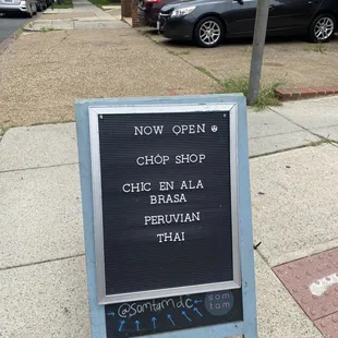 a sign on the side of the street