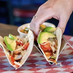 two tacos with avocado
