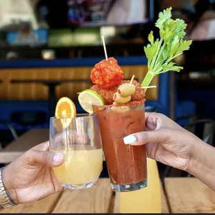 a bloody drink with a garnish