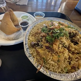 Mutton biryani and samosas