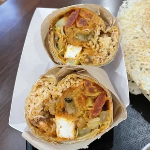 Paneer samosa wrap doused in mali sauce