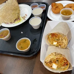 Our feast with rava dosa (left), paneer samosa wrap (front right) and rava in back