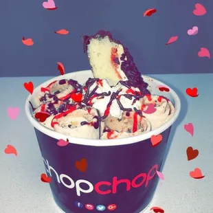 a cup of ice cream with sprinkles
