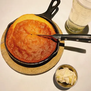 a skillet and a bowl of butter