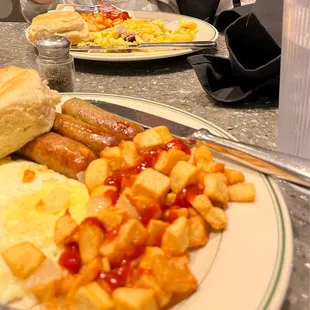 Eggs over medium, sausage, ham omelet