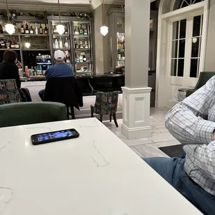 Waiting to be noticed for a pre dinner drink.
