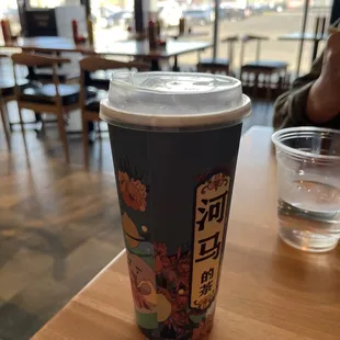 a cup of coffee on a table