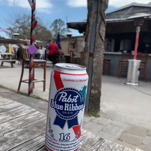 a can of beer on a table