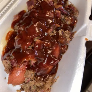 Beef Bacon Dog topped with Brisket.