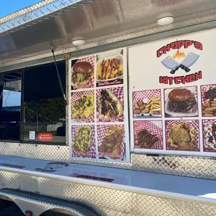 a food truck with menus on the side