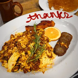 Farmers Choice: Scrambled Eggs w/ Chorizo and Potato, Bacon, and Lamb Sausage.