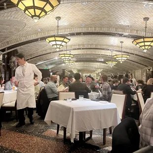 a waiter serving customers