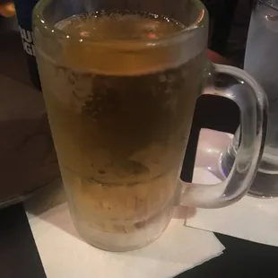 a glass of beer on a table