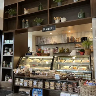 the inside of a store with a variety of foods on display