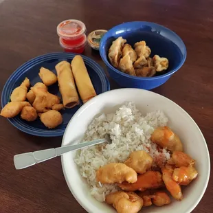 Sweet and sour chicken, white rice, fried dumplings, speing rolls
