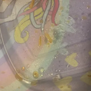 The maggot placed next to rice to show the difference