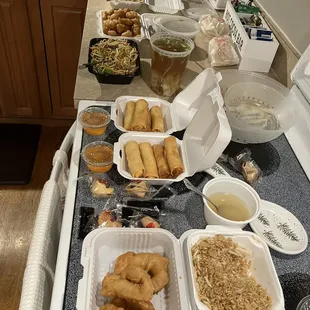 Front to back: sweet sour shrimp, egg rolls, beef lo mein, wonton soup, sweet sour chicken, almond chicken, general's chicken.
