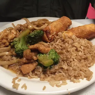 a plate of food with rice and broccoli