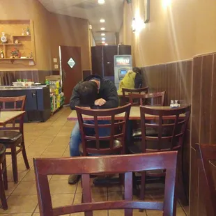 This is my view while I eat my food. 2 employees sleeping while 3 more are on their phones.......