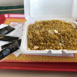 a tray of rice with chopsticks