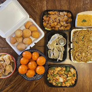 Crab rangoons, donuts, steamed dumplings, garlic chicken, sesame chicken, chicken lo mein, and fried rice