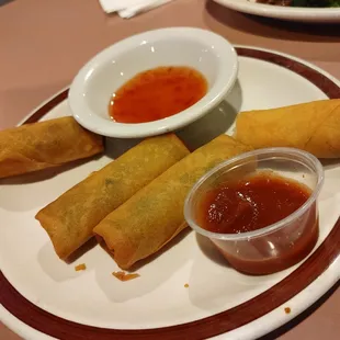 a plate of food with dipping sauce