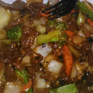 a plate of stir fried vegetables