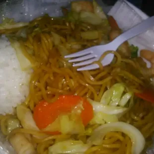 a plate of noodles and shrimp