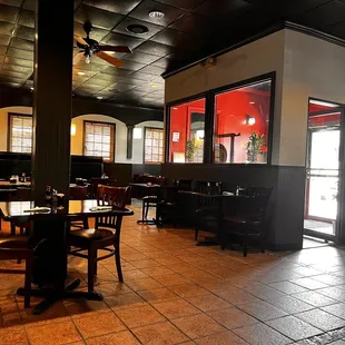 a dining area with tables and chairs