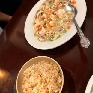 a bowl of rice and a bowl of soup on a table
