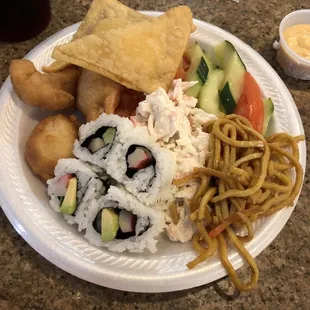 Sushi, crab Rangoon. Cucumber salad, tomatoes, lo mien, snow crab salad, sweet and sour chicken, spicy Mayo