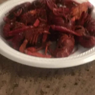 a plate of cooked craws