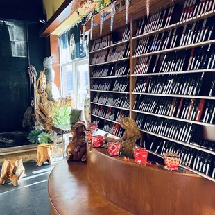 a wine shop with bottles of wine on the counter