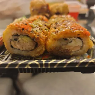 a plate of sushi rolls