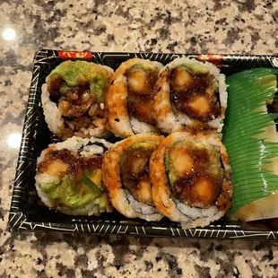 a plate of sushi rolls