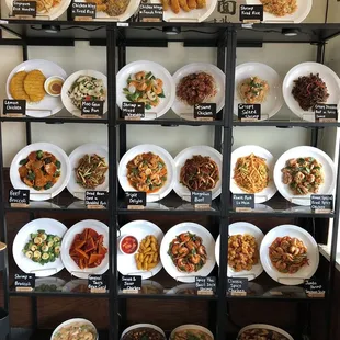 a display of plates of asian food