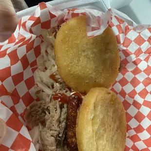 Arepa de pernil y queso (pulled pork and cheese)