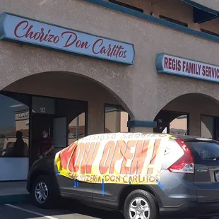 a car parked in front of a restaurant