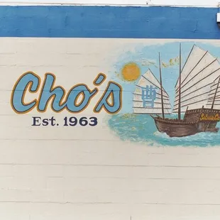 a boat painted on the side of a building