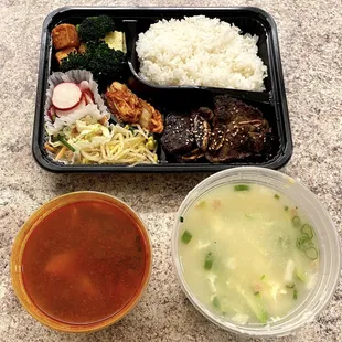 Korean Style Grilled Beef Ribs and Soft Tofu Stew Combo and Sliced Rice Cake Soup with Dumplings