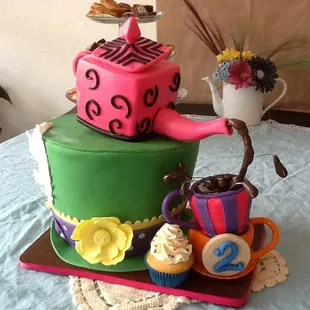 a teapot and cupcakes