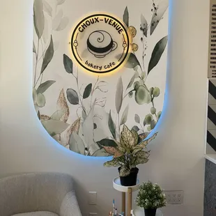 a coffee shop with a wall mural