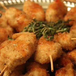 a platter of shrimp skewers