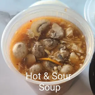 hot and sour soup in a plastic cup