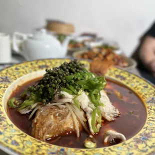 a plate of soup with broccoli