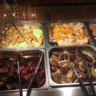 a variety of food items in a buffet