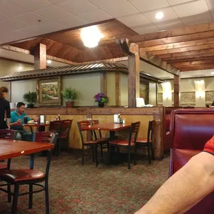 a man sitting at a table in a restaurant