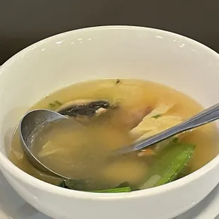 a bowl of soup with a spoon