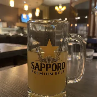 a glass of sapporo beer