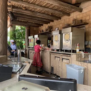 a woman standing at a bar